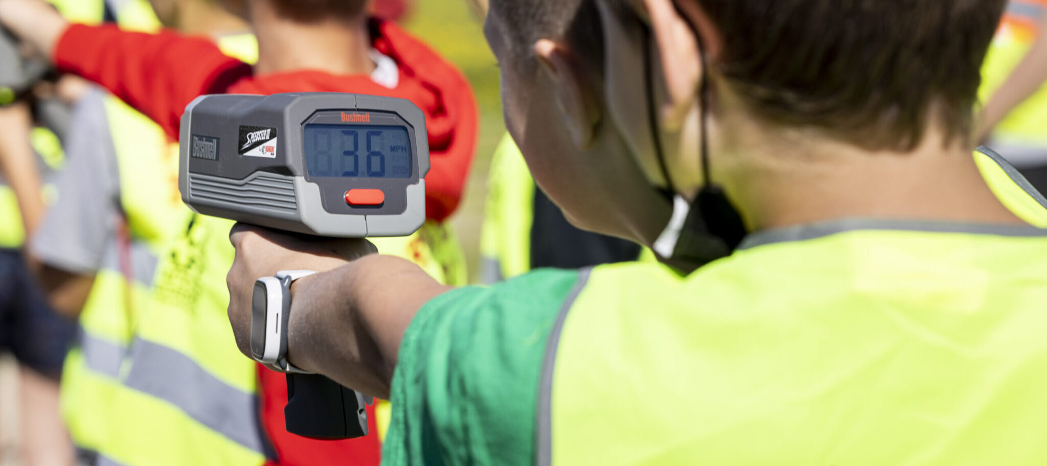 Project RADAR students using radar guns to collect speed of traffic